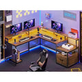 L-Shaped Corner Desk – Brown, RGB LED Strip, File Drawer, Monitor Shelf, Power Outlet, Seats 2